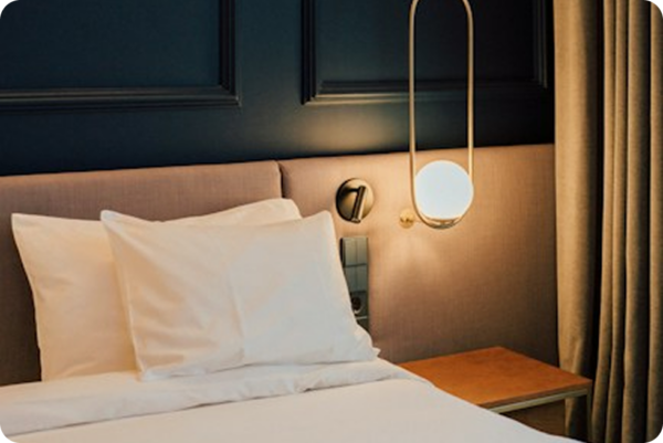 Samples of what our partners offer: a hotel room, a café and the Design Hotels book.